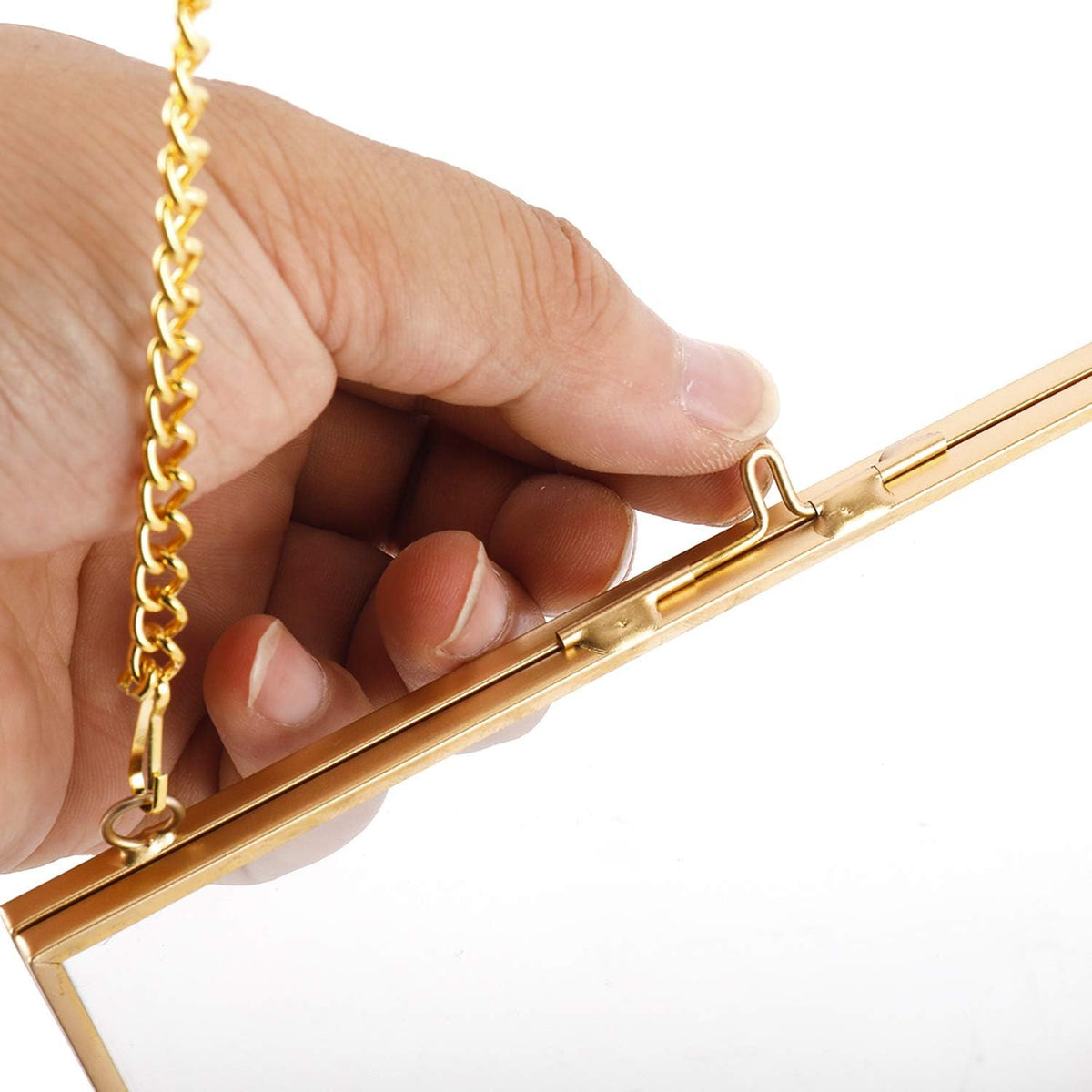 Close-up of the small clasp on the gold-tone square hanging double-glass frame.