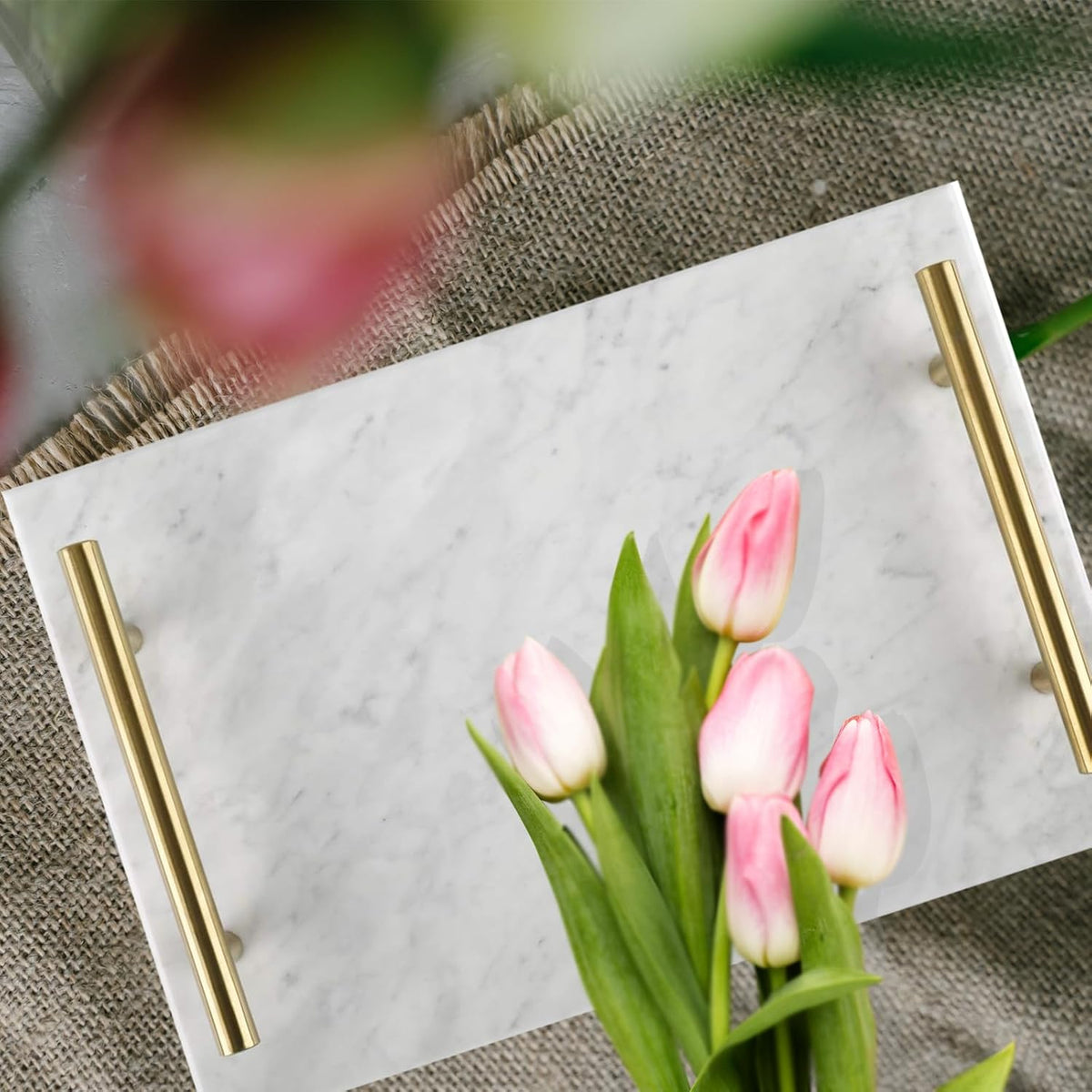 White marble tray photographed with flowers; flowers not included